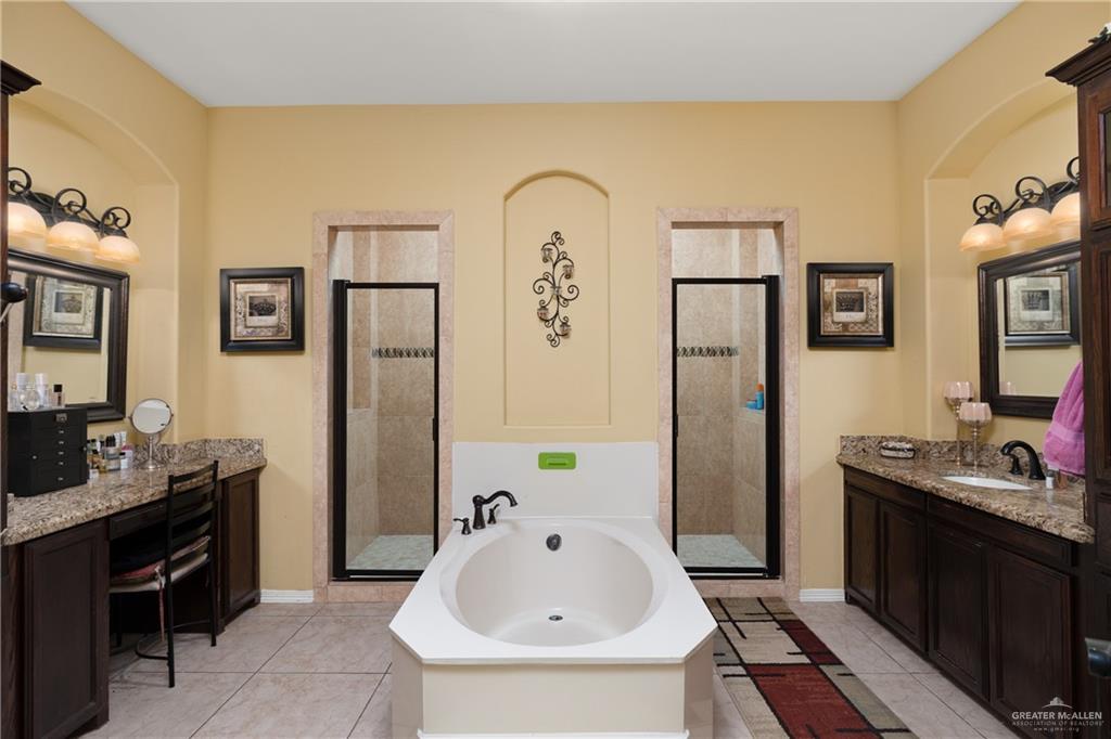 1502 Eucalyptus Street Weslaco, TX 78599 - Photo 11 of 24 a bathroom with a sink a toilet and mirror