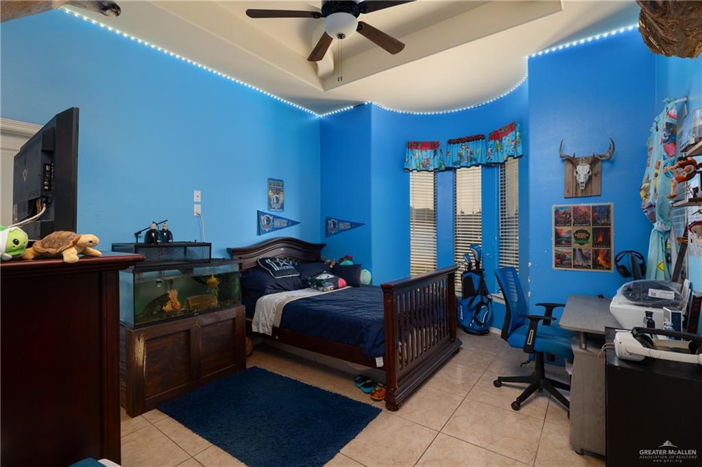 1502 Eucalyptus Street Weslaco, TX 78599 - Photo 12 of 24 a bedroom with furniture and a window