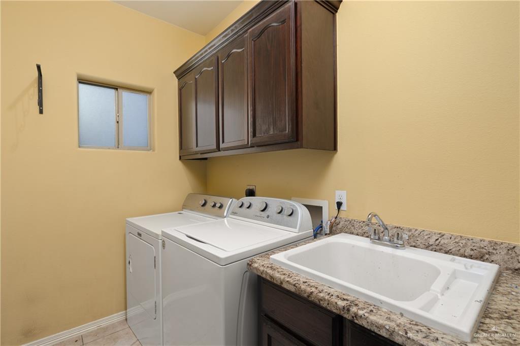 1502 Eucalyptus Street Weslaco, TX 78599 - Photo 15 of 24 a bathroom with a sink and a toilet