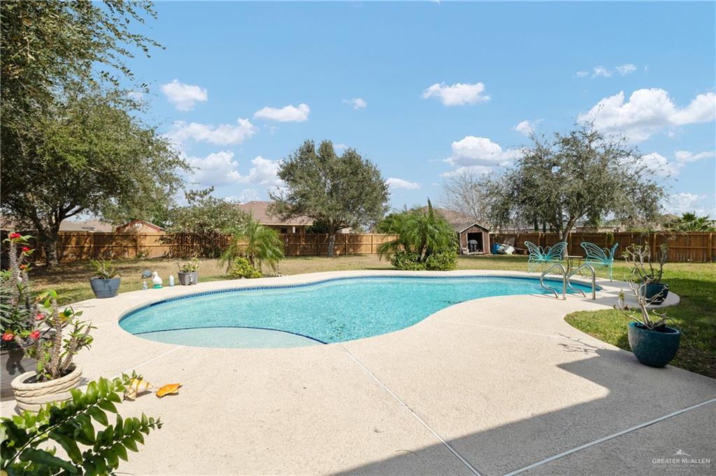 1502 Eucalyptus Street Weslaco, TX 78599 - Photo 17 of 24 a view of a swimming pool and a yard