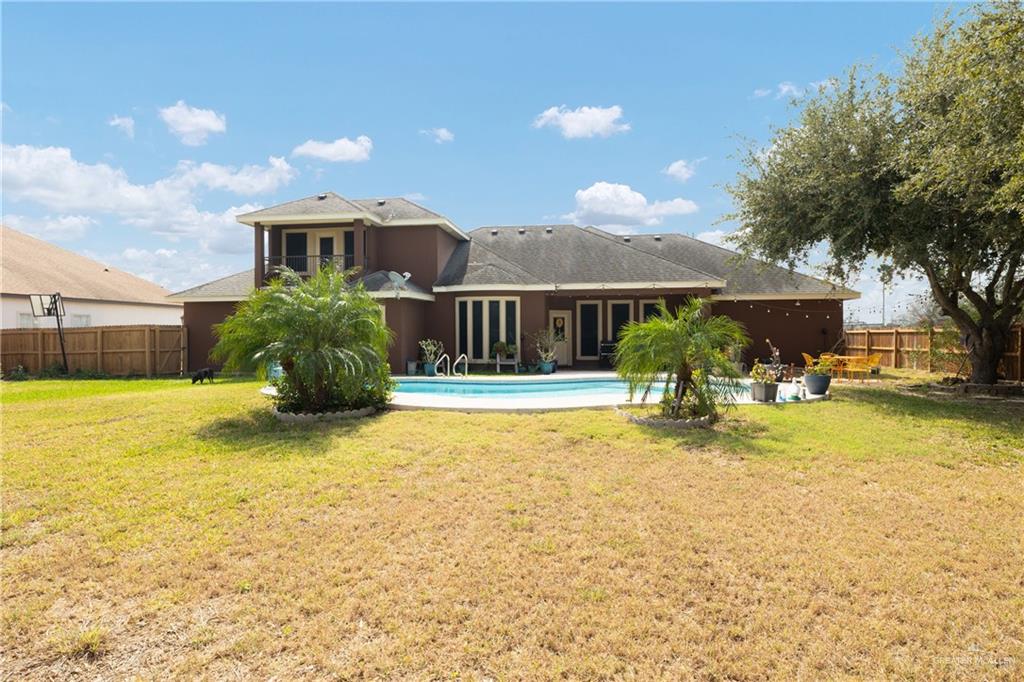 1502 Eucalyptus Street Weslaco, TX 78599 - Photo 18 of 24 a view of a house with a yard