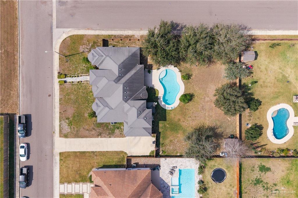 1502 Eucalyptus Street Weslaco, TX 78599 - Photo 20 of 24 an aerial view of a house with outdoor space and swimming pool