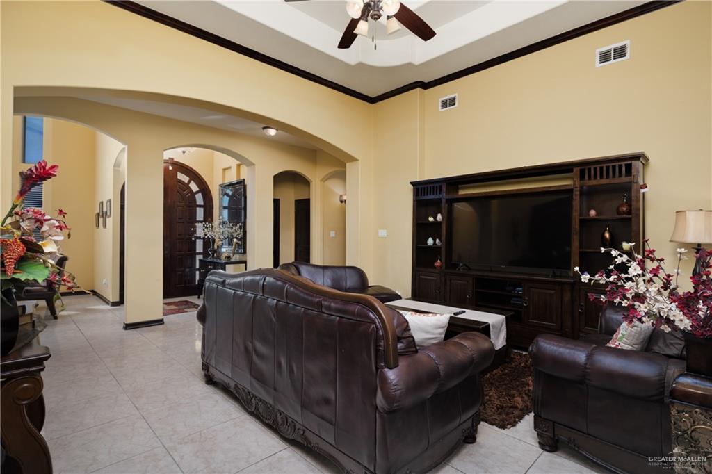 1502 Eucalyptus Street Weslaco, TX 78599 - Photo 3 of 24 a living room with furniture and a flat screen tv