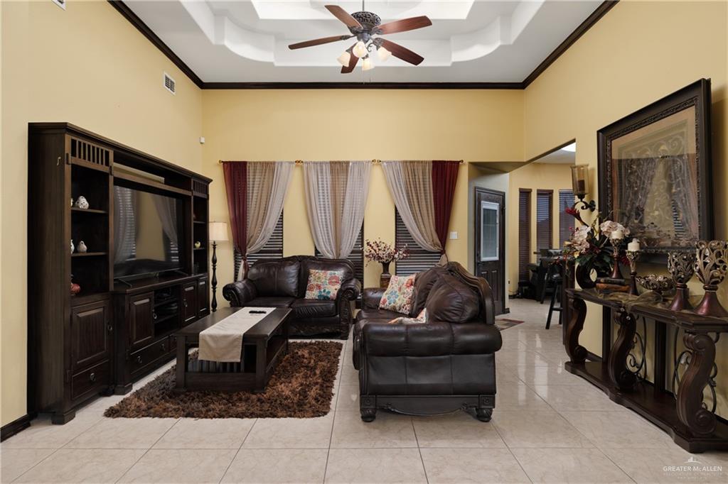 1502 Eucalyptus Street Weslaco, TX 78599 - Photo 4 of 24 a living room with furniture and a flat screen tv