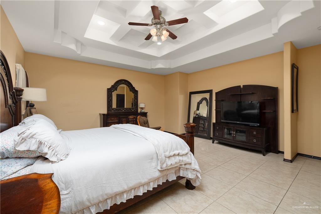 1502 Eucalyptus Street Weslaco, TX 78599 - Photo 10 of 24 a bedroom with a bed and a television