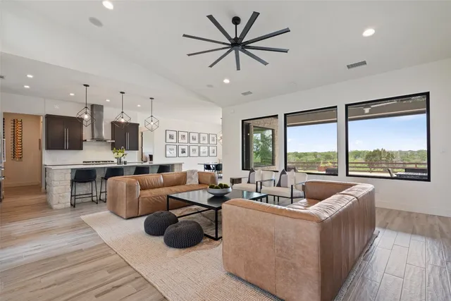 a view of a city with lush green forest