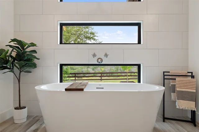 a bedroom with a bed and a mirror