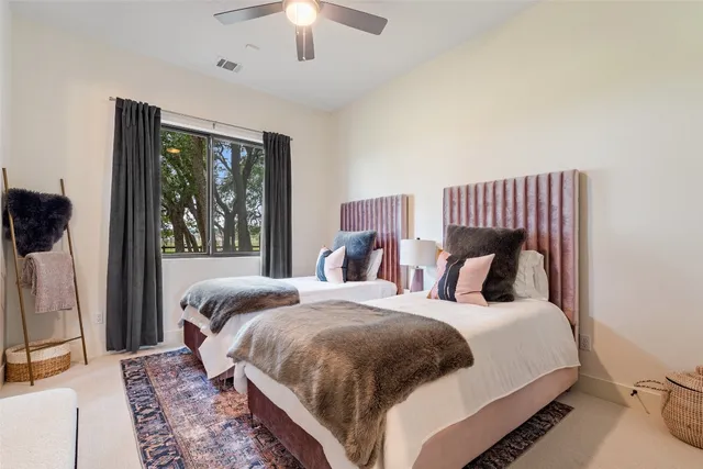 a bathroom with a granite countertop toilet sink a mirror a shower and vanity