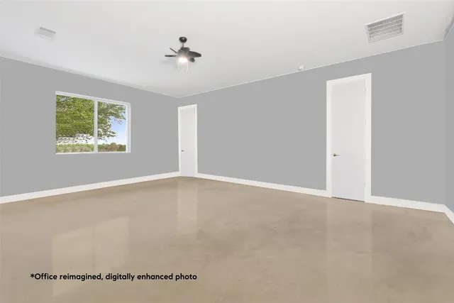 a living room with a piano table and windows