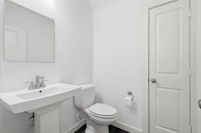 a kitchen with sink cabinets and wooden floor