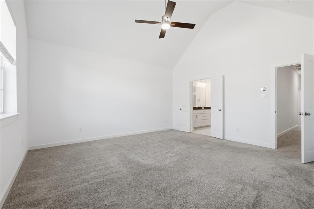 531 Cobblestone Lane Irving, TX 75039 - Photo 17 of 39 an empty room with an entryway and a window