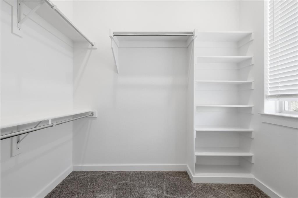 531 Cobblestone Lane Irving, TX 75039 - Photo 18 of 39 a view of an empty walk in closet