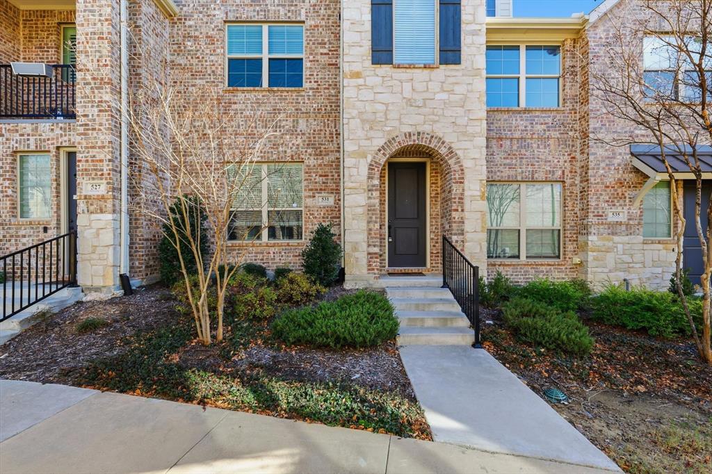 531 Cobblestone Lane Irving, TX 75039 - Photo 2 of 39 a front view of a house with garden