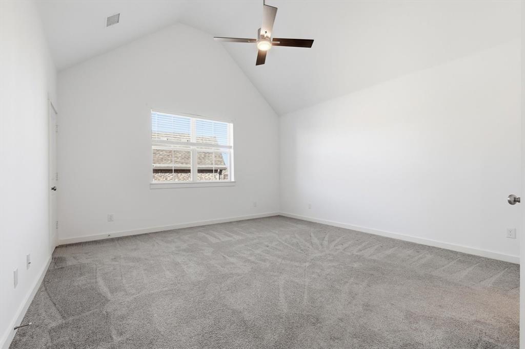 531 Cobblestone Lane Irving, TX 75039 - Photo 24 of 39 an empty room with a window and a ceiling fan