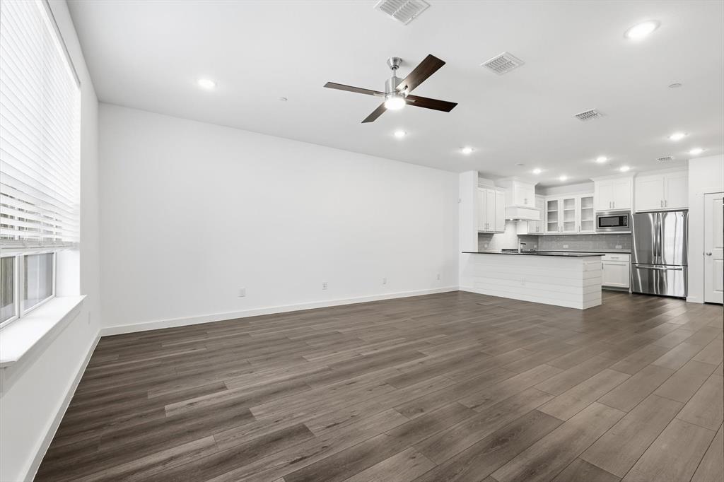 531 Cobblestone Lane Irving, TX 75039 - Photo 4 of 39 a view of a kitchen with a dishwasher cabinets and wooden floor
