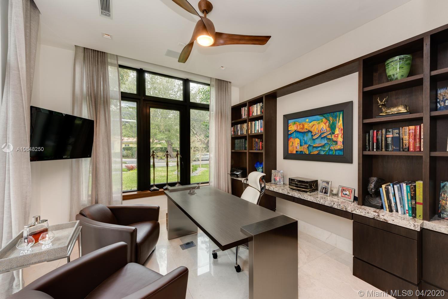 810 Jeronimo Drive Coral Gables, FL 33146 - Photo 12 of 32 a living room with furniture and a flat screen tv
