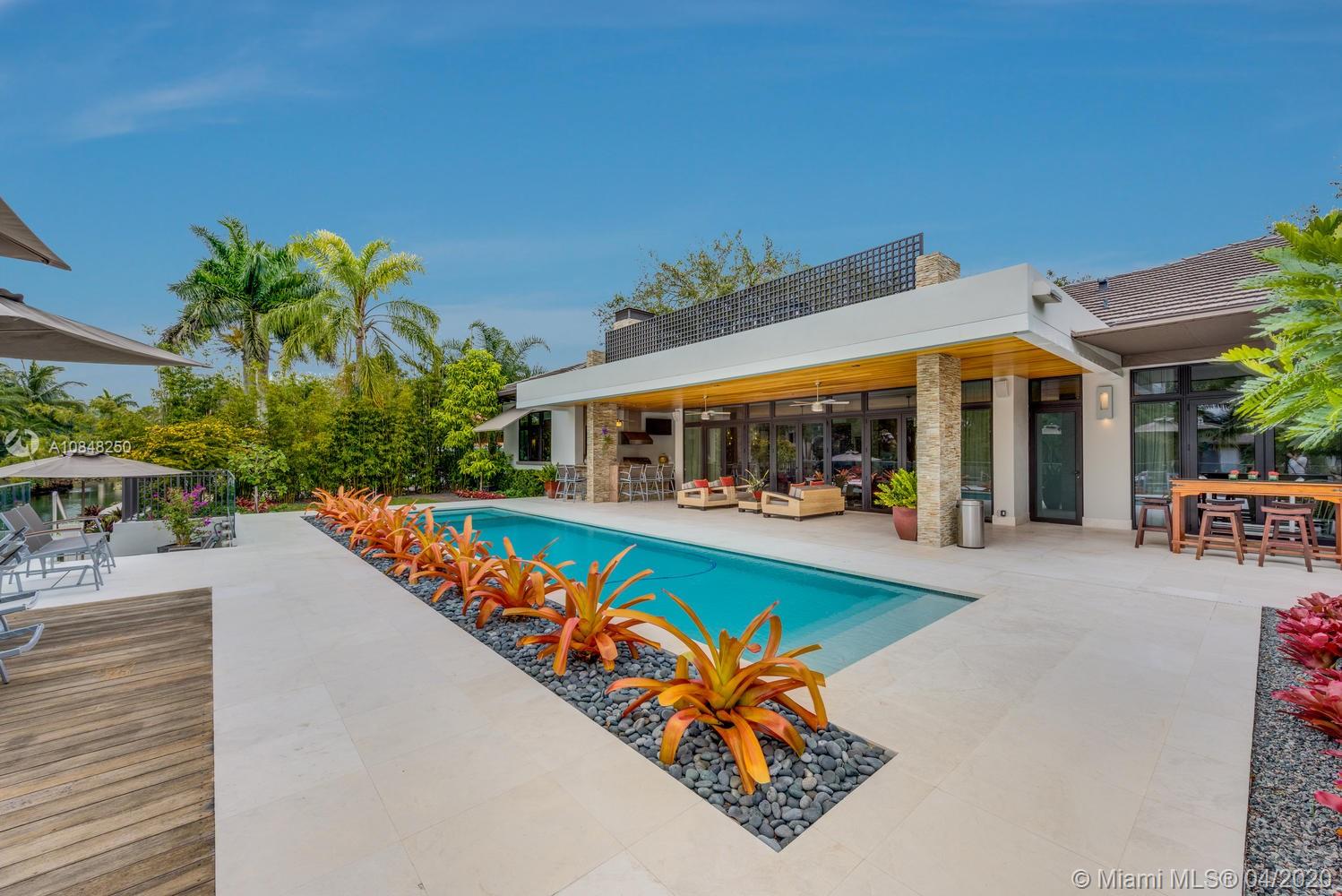 810 Jeronimo Drive Coral Gables, FL 33146 - Photo 2 of 32 swimming pool with outdoor seating