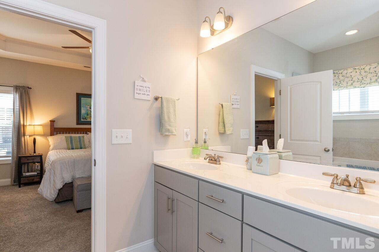 3508 Jones Lake Road Fuquay-Varina, NC 27526 - Photo 15 of 41 a en suite bathroom with double vanity sinks and a mirror
