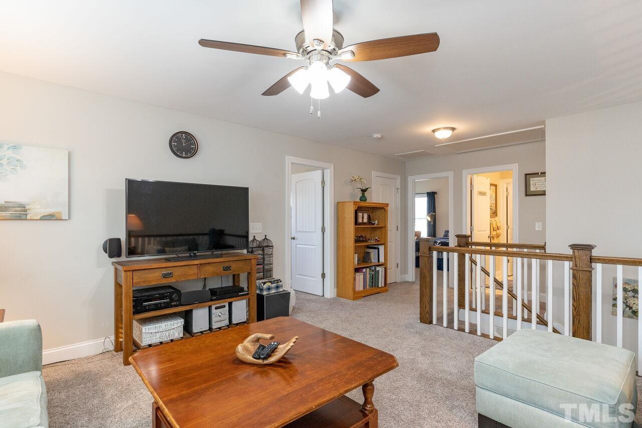 3508 Jones Lake Road Fuquay-Varina, NC 27526 - Photo 18 of 41 a living room with furniture and a flat screen tv