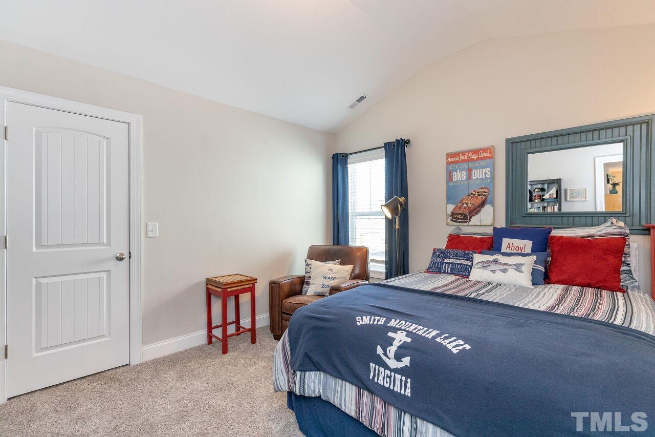 3508 Jones Lake Road Fuquay-Varina, NC 27526 - Photo 20 of 41 a bedroom with bed and window