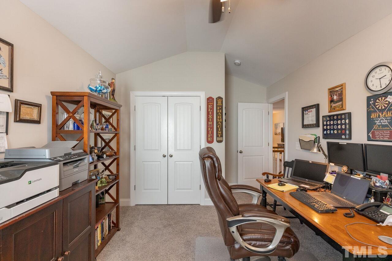 3508 Jones Lake Road Fuquay-Varina, NC 27526 - Photo 22 of 41 a view of a workspace with furniture and a window