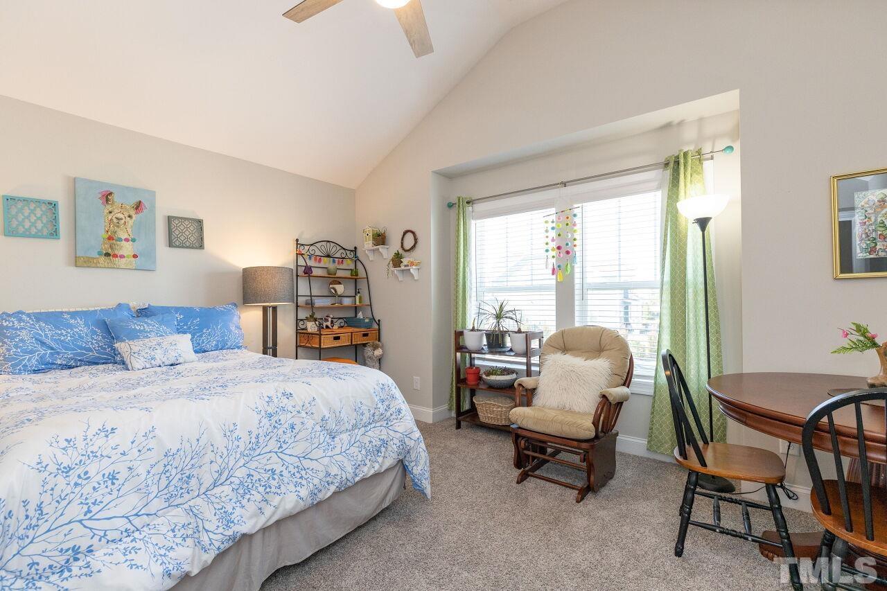 3508 Jones Lake Road Fuquay-Varina, NC 27526 - Photo 24 of 41 a bedroom with a bed and large windows