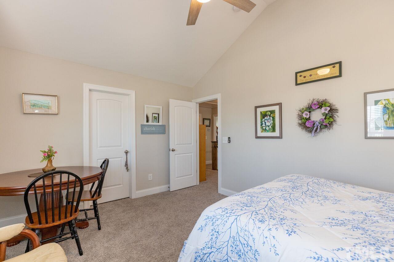 3508 Jones Lake Road Fuquay-Varina, NC 27526 - Photo 25 of 41 a bedroom with a bed and a chair