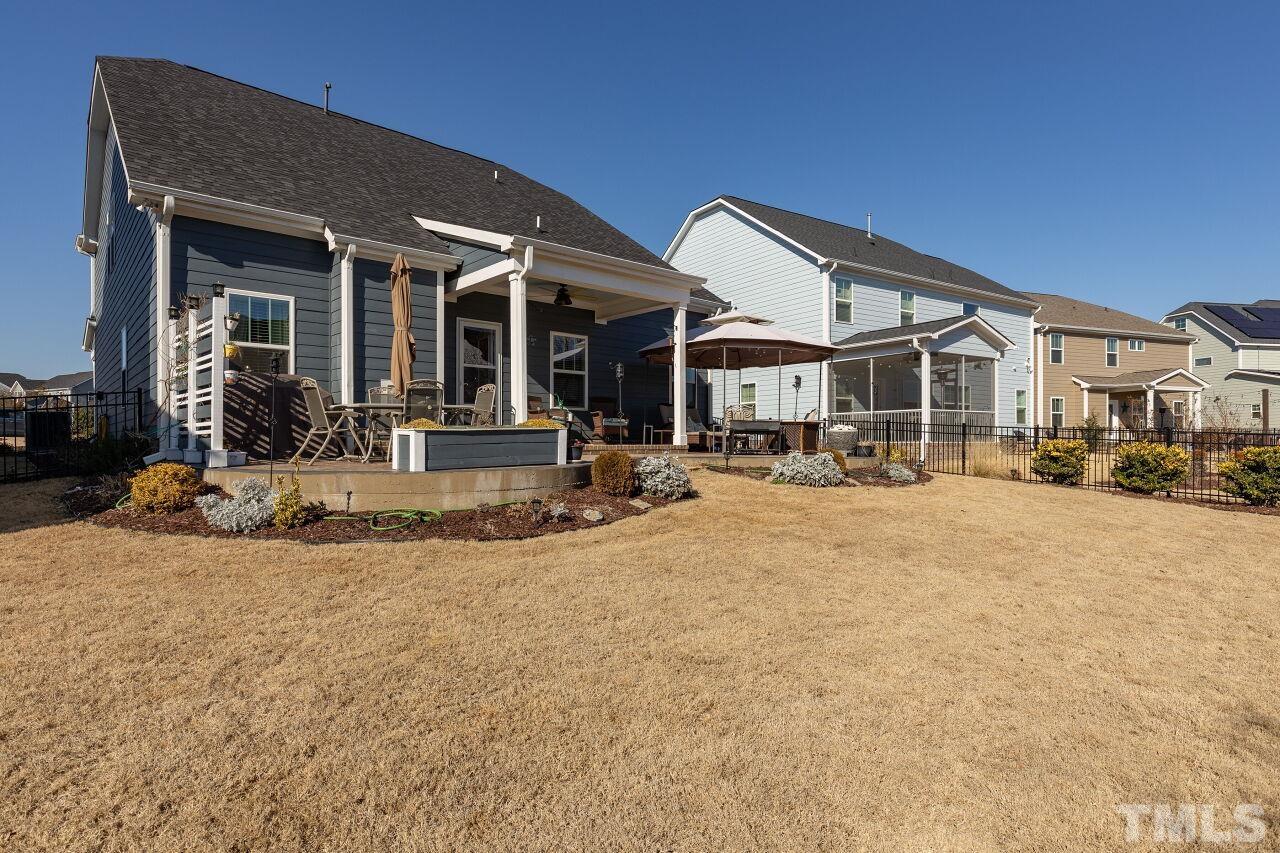 3508 Jones Lake Road Fuquay-Varina, NC 27526 - Photo 29 of 41 a view of a building with a large tree in front of it