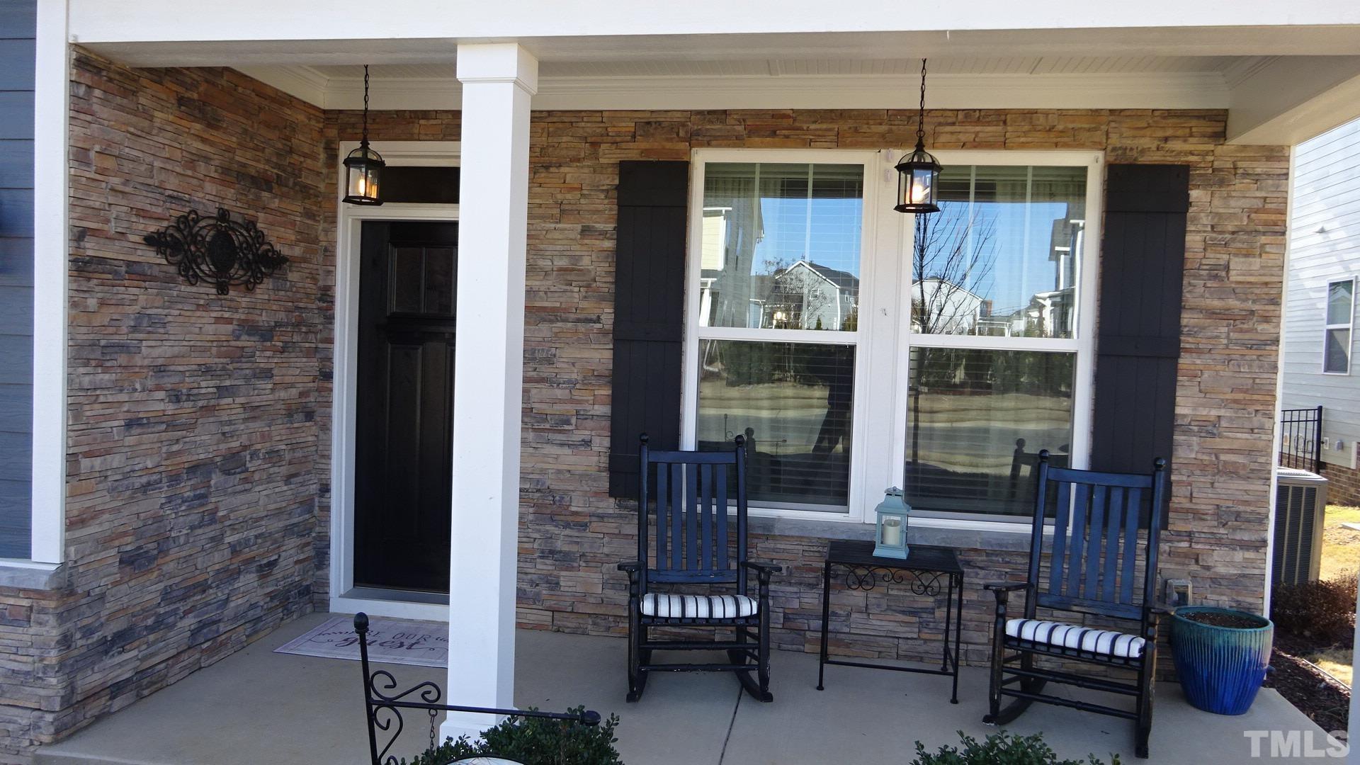3508 Jones Lake Road Fuquay-Varina, NC 27526 - Photo 3 of 41 a front view of a house with outdoor seating