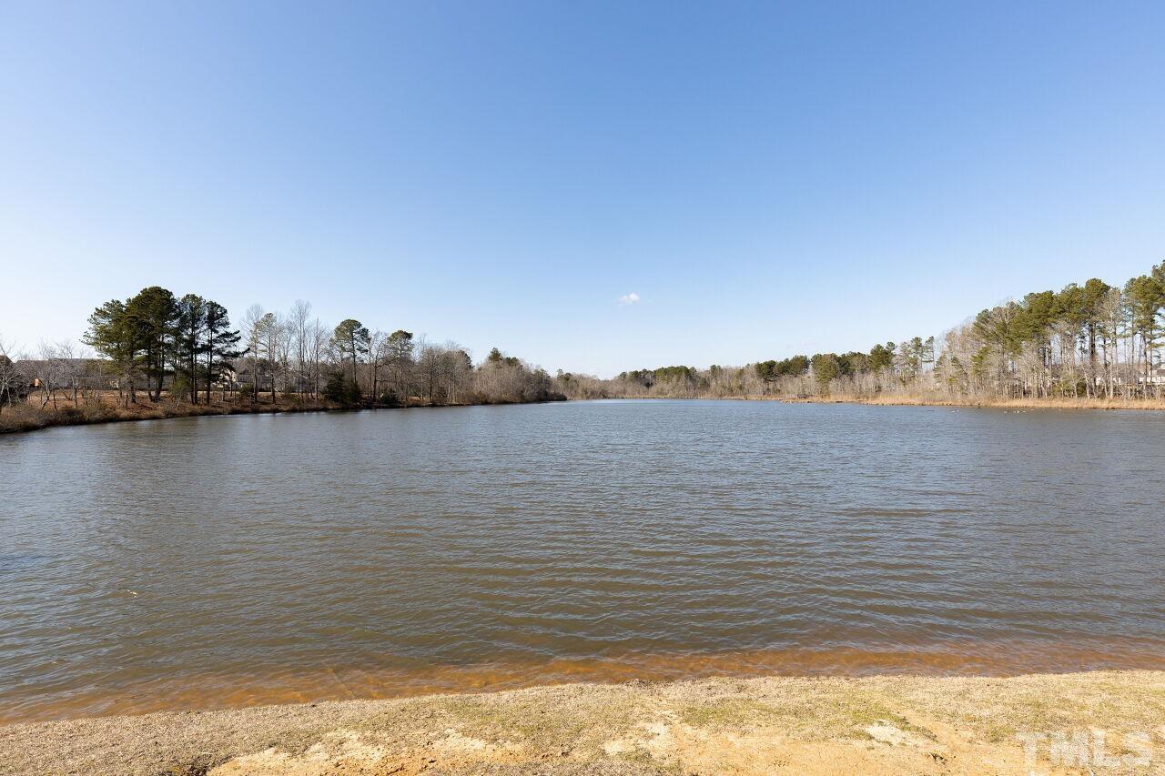 3508 Jones Lake Road Fuquay-Varina, NC 27526 - Photo 33 of 41 a view of a lake with houses in the back