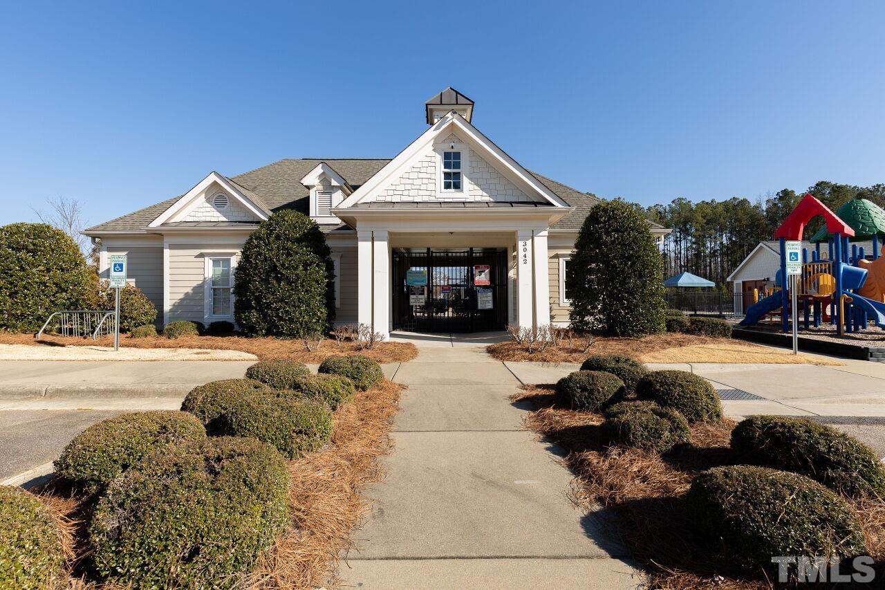 3508 Jones Lake Road Fuquay-Varina, NC 27526 - Photo 34 of 41 a front view of a house with a yard and garage