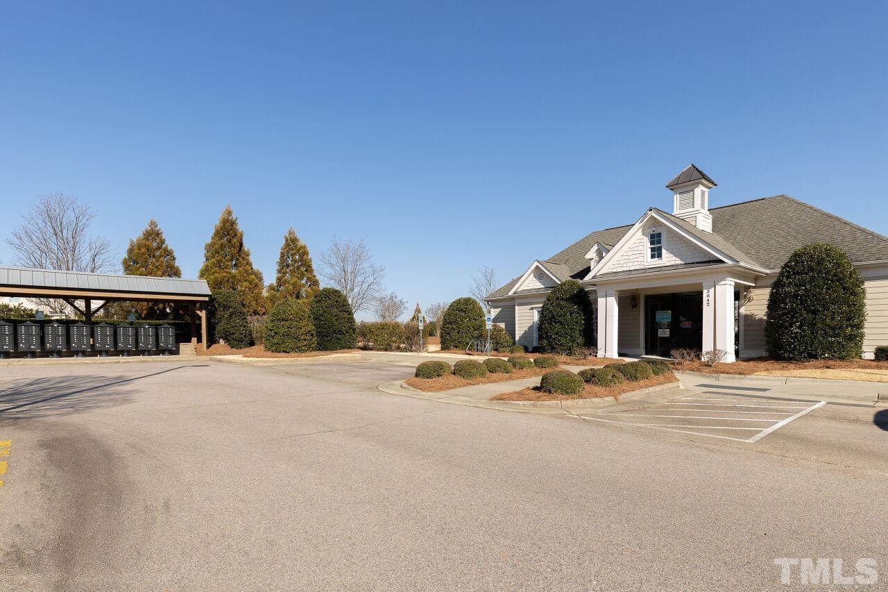 3508 Jones Lake Road Fuquay-Varina, NC 27526 - Photo 35 of 41 a view of a house with a yard and large trees