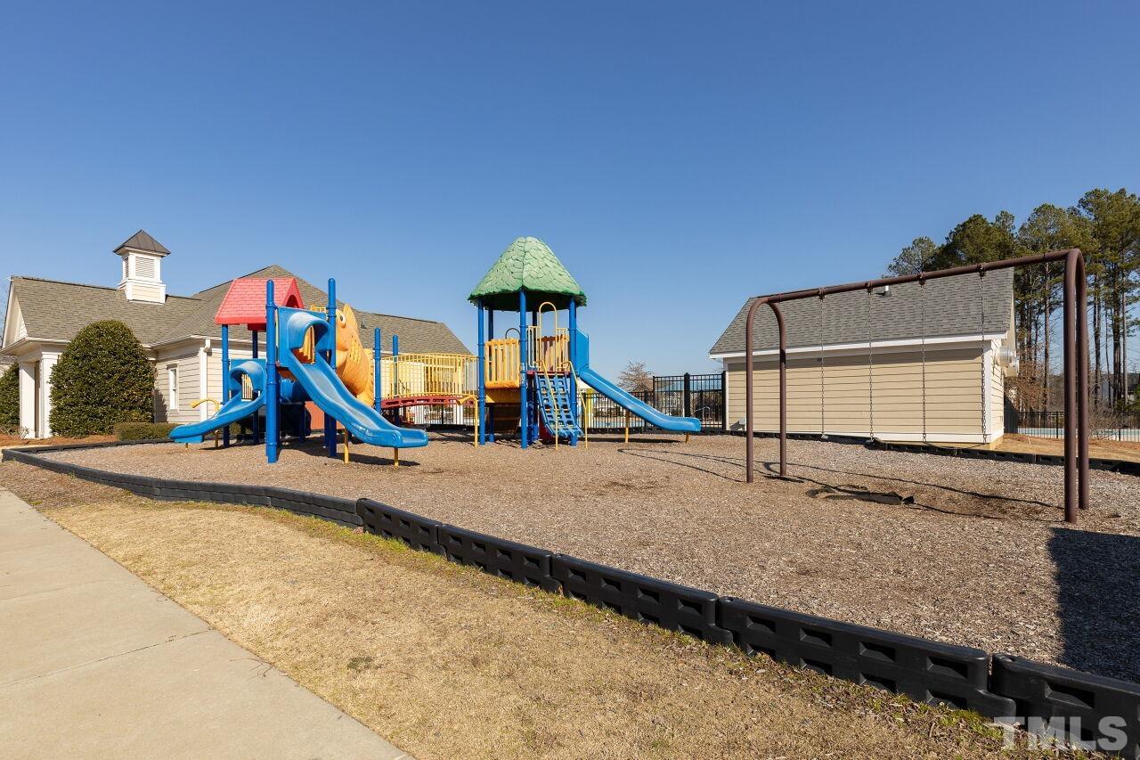 3508 Jones Lake Road Fuquay-Varina, NC 27526 - Photo 37 of 41 a group of people standing next to a road
