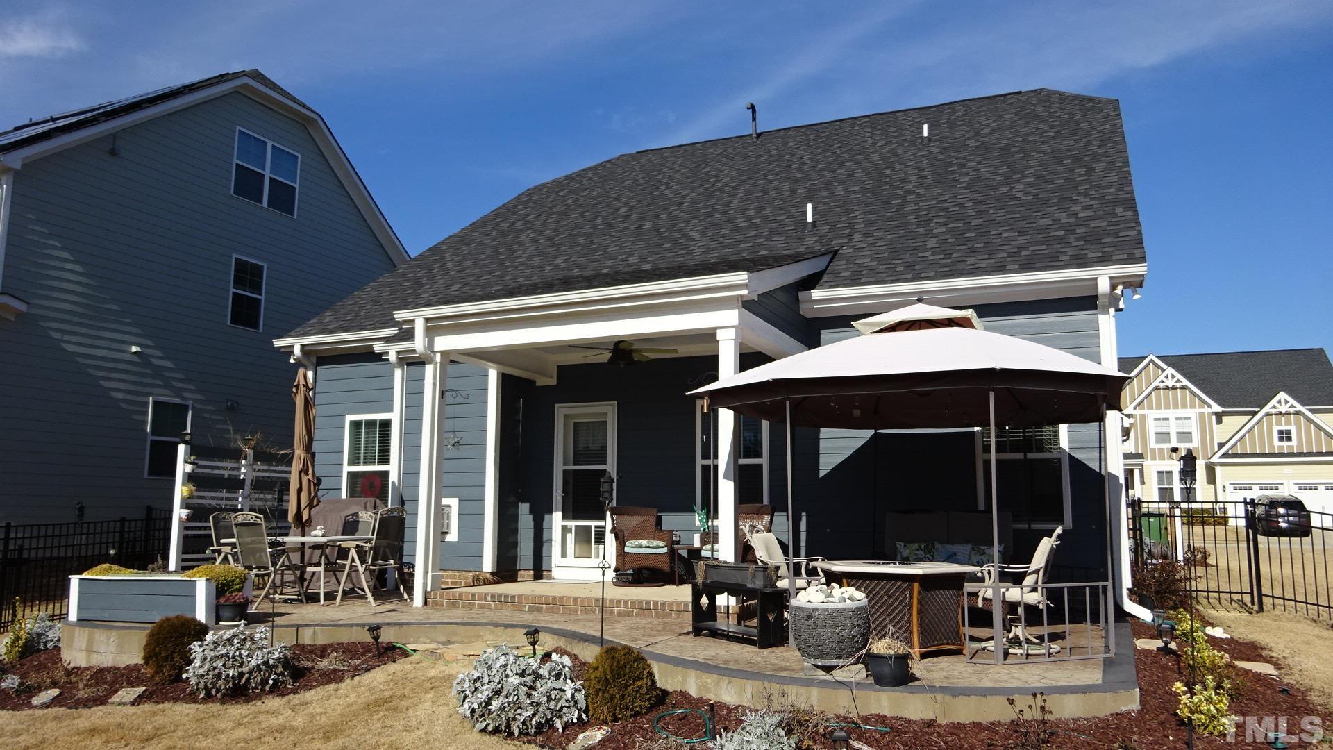 3508 Jones Lake Road Fuquay-Varina, NC 27526 - Photo 4 of 41 a front view of a house with outdoor seating