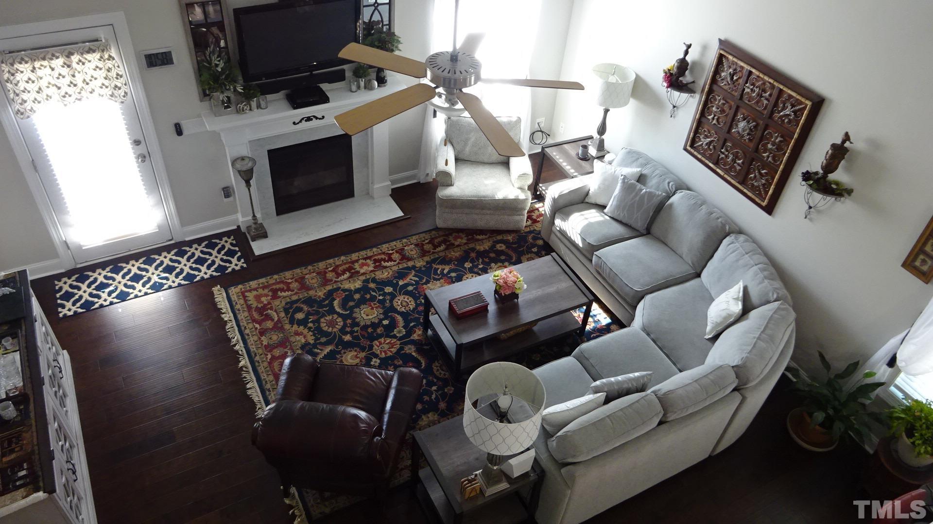 3508 Jones Lake Road Fuquay-Varina, NC 27526 - Photo 10 of 41 a living room with furniture and a fireplace