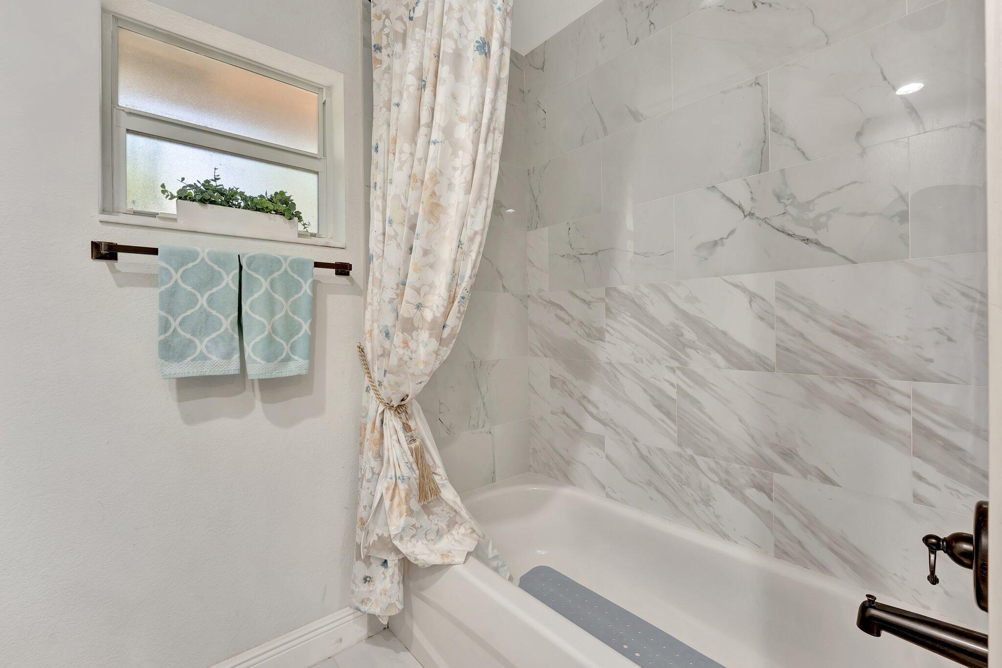 4901 Lincoln Road Delray Beach, FL 33445 - Photo 28 of 56 a bathroom with a shower