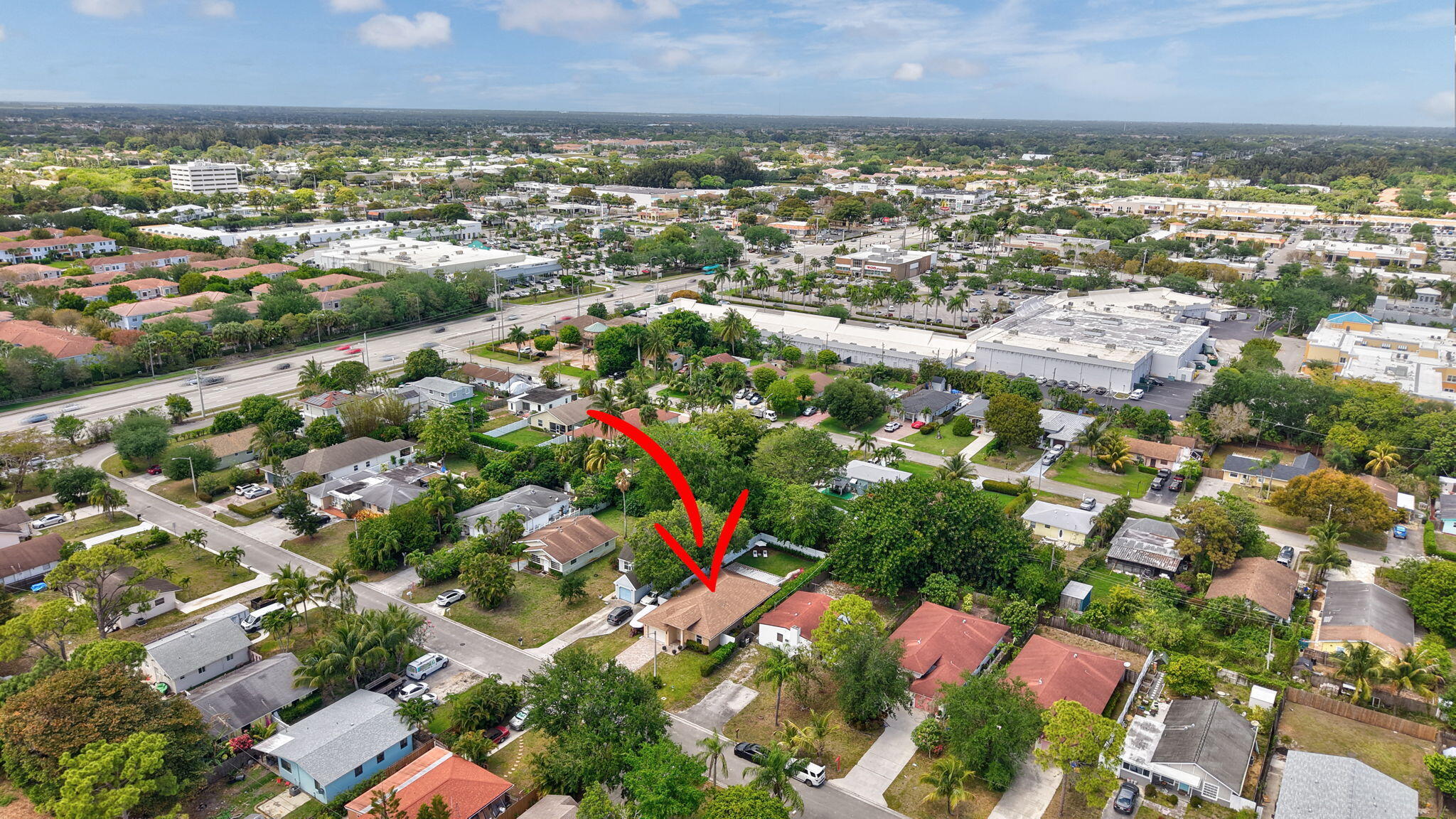 4901 Lincoln Road Delray Beach, FL 33445 - Photo 42 of 56 an aerial view of residential building and lake