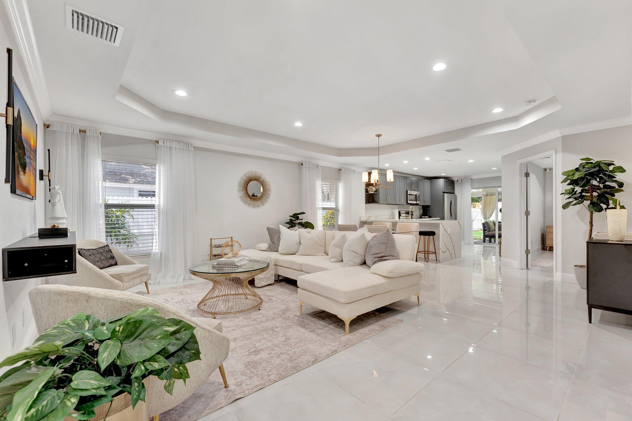 4901 Lincoln Road Delray Beach, FL 33445 - Photo 6 of 56 a living room with furniture and a flat screen tv
