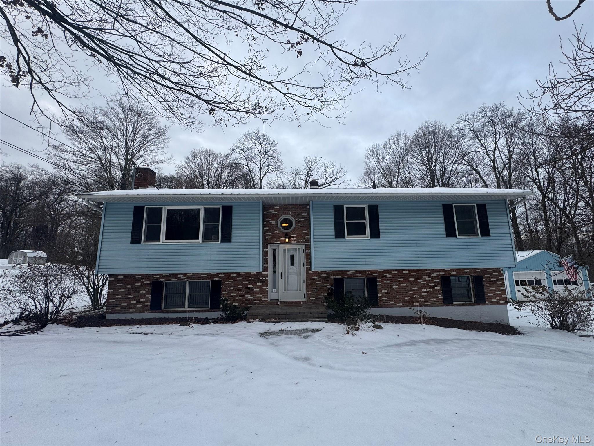 2217 Highway 300, Unit 1 Wallkill, NY 12589 - Photo 1 of 22 a front view of a house with a yard