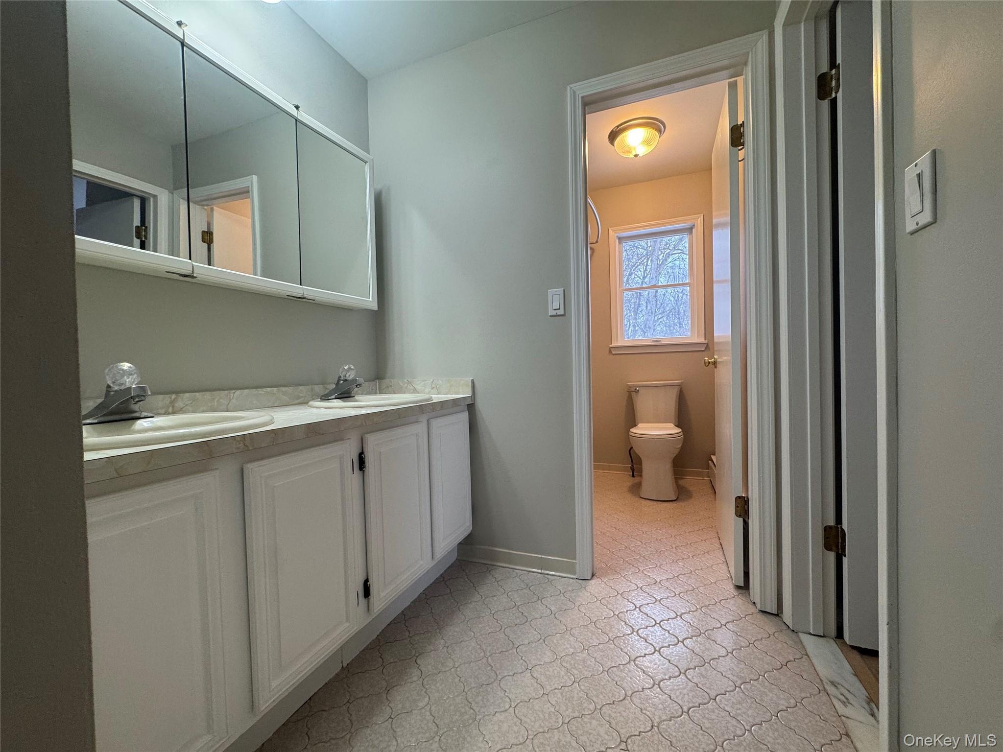 2217 Highway 300, Unit 1 Wallkill, NY 12589 - Photo 11 of 22 a bathroom with a sink and a mirror