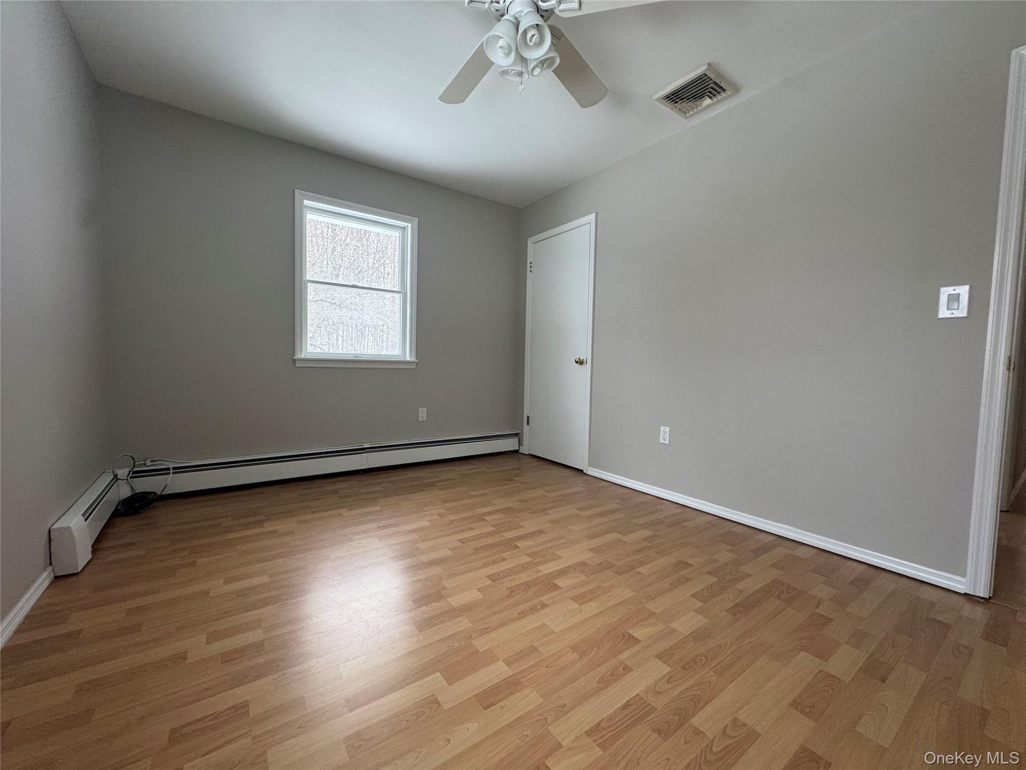 2217 Highway 300, Unit 1 Wallkill, NY 12589 - Photo 17 of 22 wooden floor in an empty room with a window