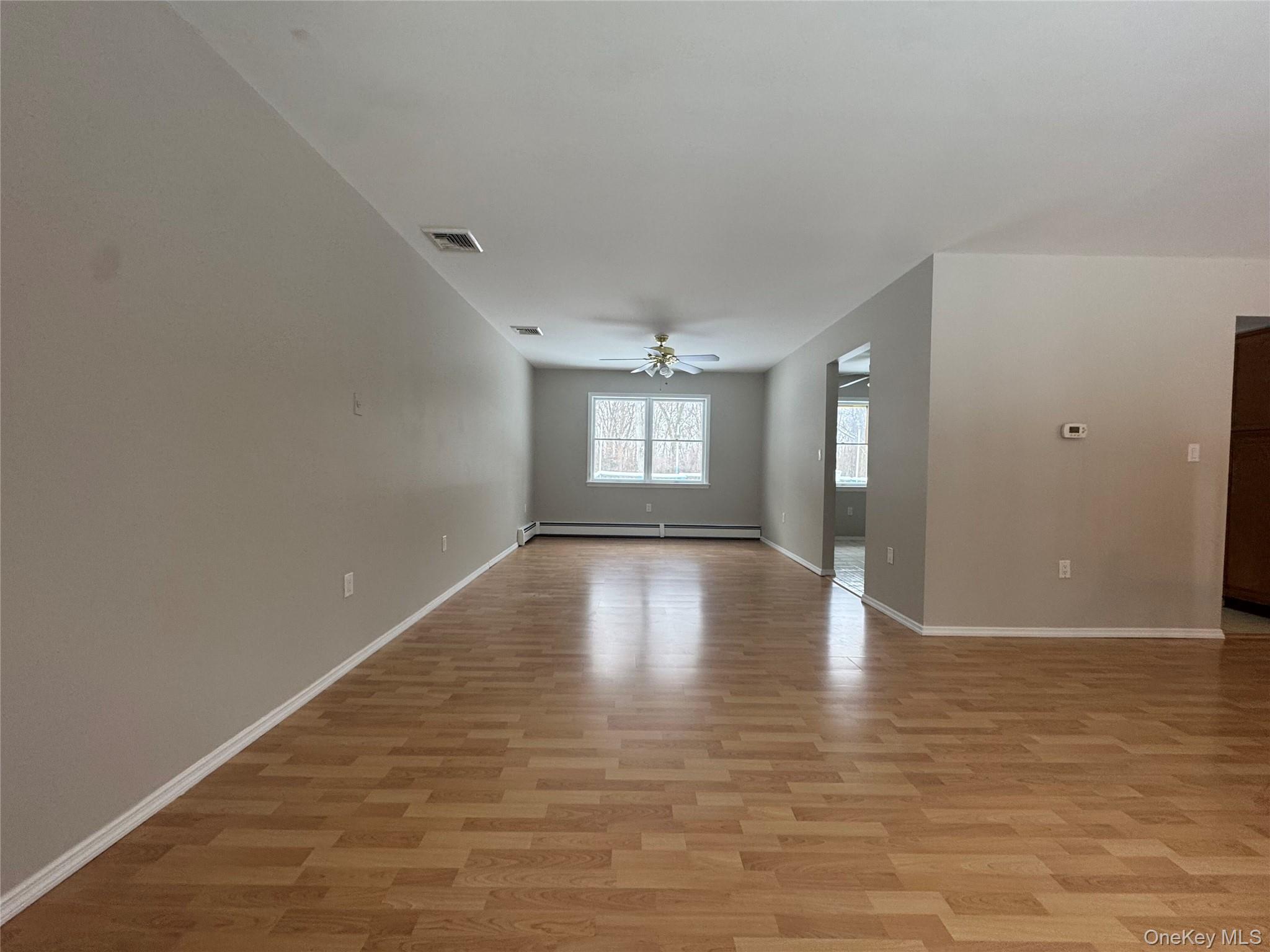 2217 Highway 300, Unit 1 Wallkill, NY 12589 - Photo 7 of 22 a view of empty room with wooden floor and window