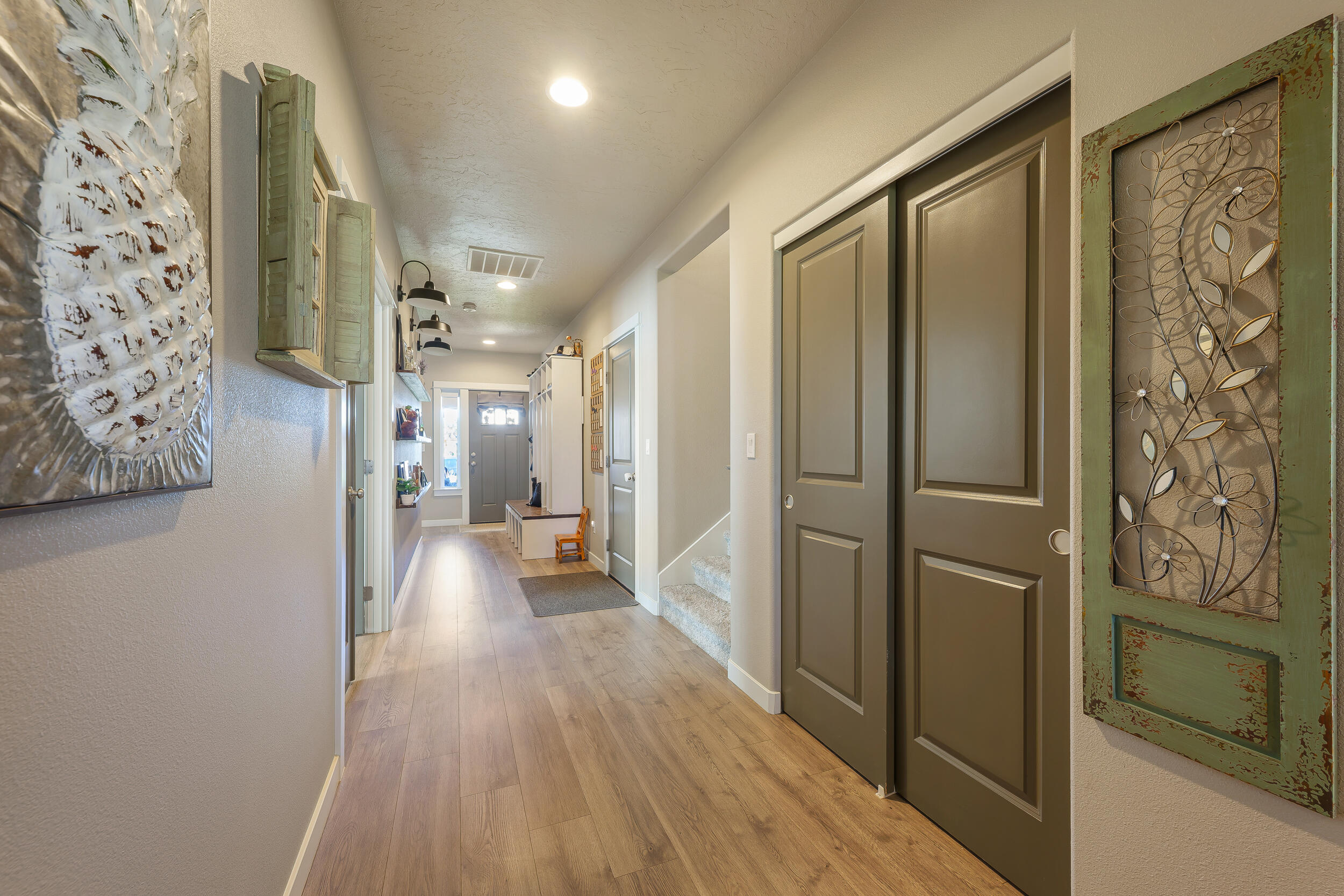 3370 Northwest 15th Street Redmond, OR 97756 - Photo 12 of 27 a view of hallway with wooden floor and stairs