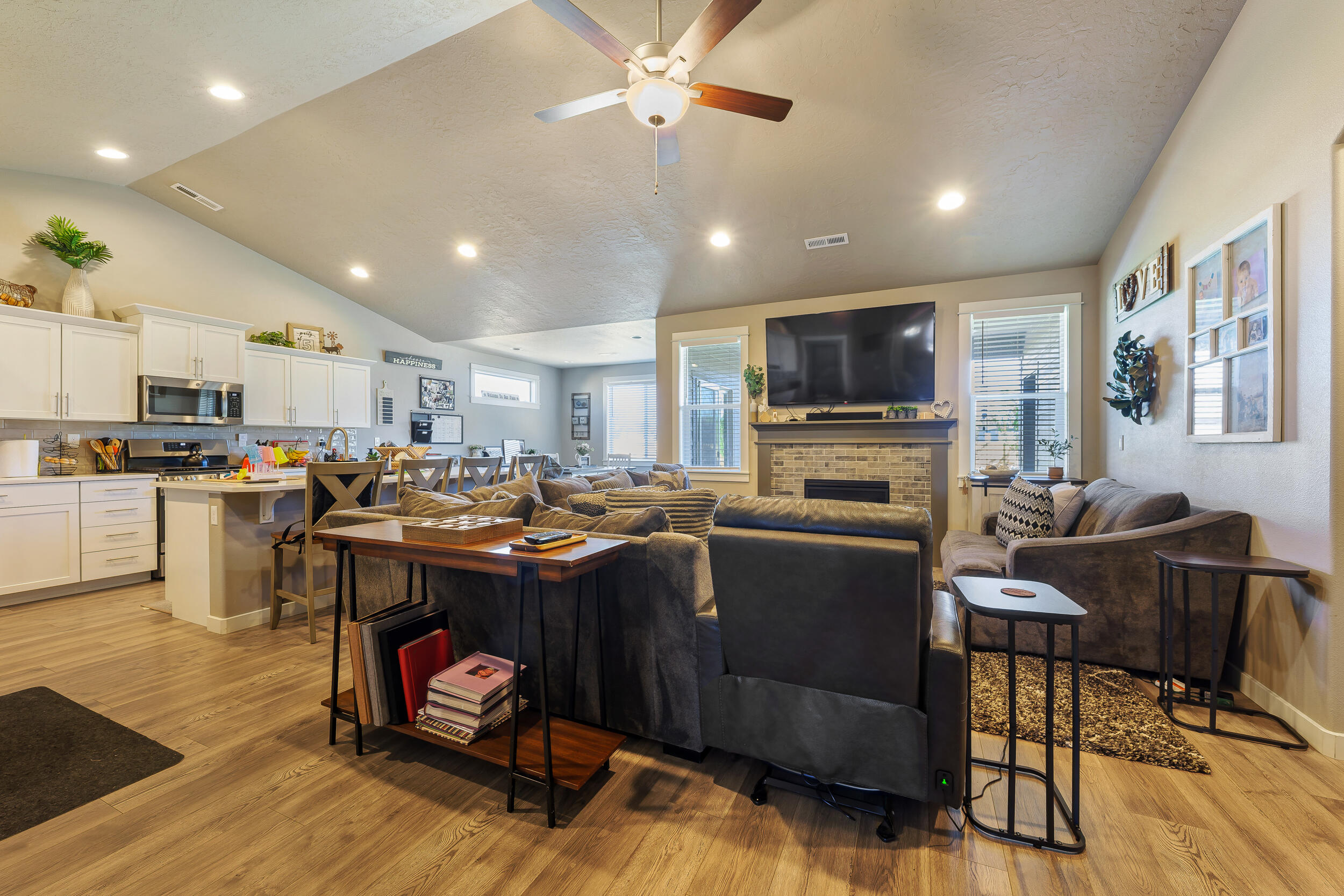 3370 Northwest 15th Street Redmond, OR 97756 - Photo 3 of 27 a living room with furniture and a flat screen tv with kitchen view