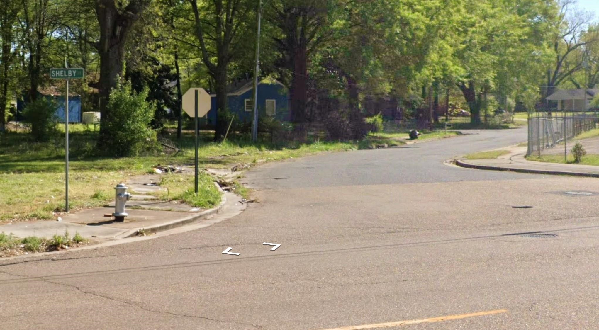 4696 Dalton Road Memphis, TN 38109 - Photo 9 of 10 View of asphalt road with curbs, sidewalks, and traffic signs