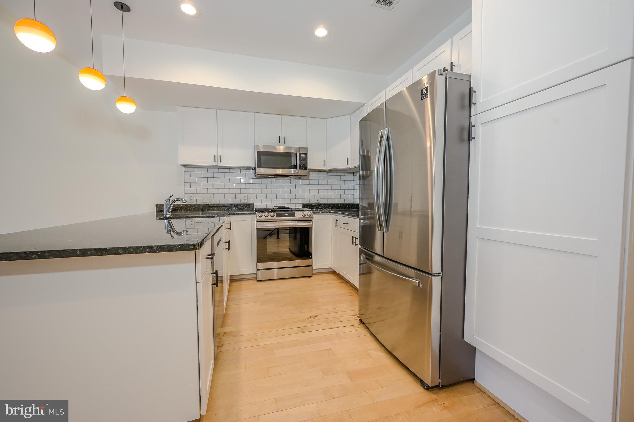 1328 Maryland Avenue Northeast, Unit 3 Washington, DC 20002 - Photo 4 of 20 Kitchen with stainless steel appliances