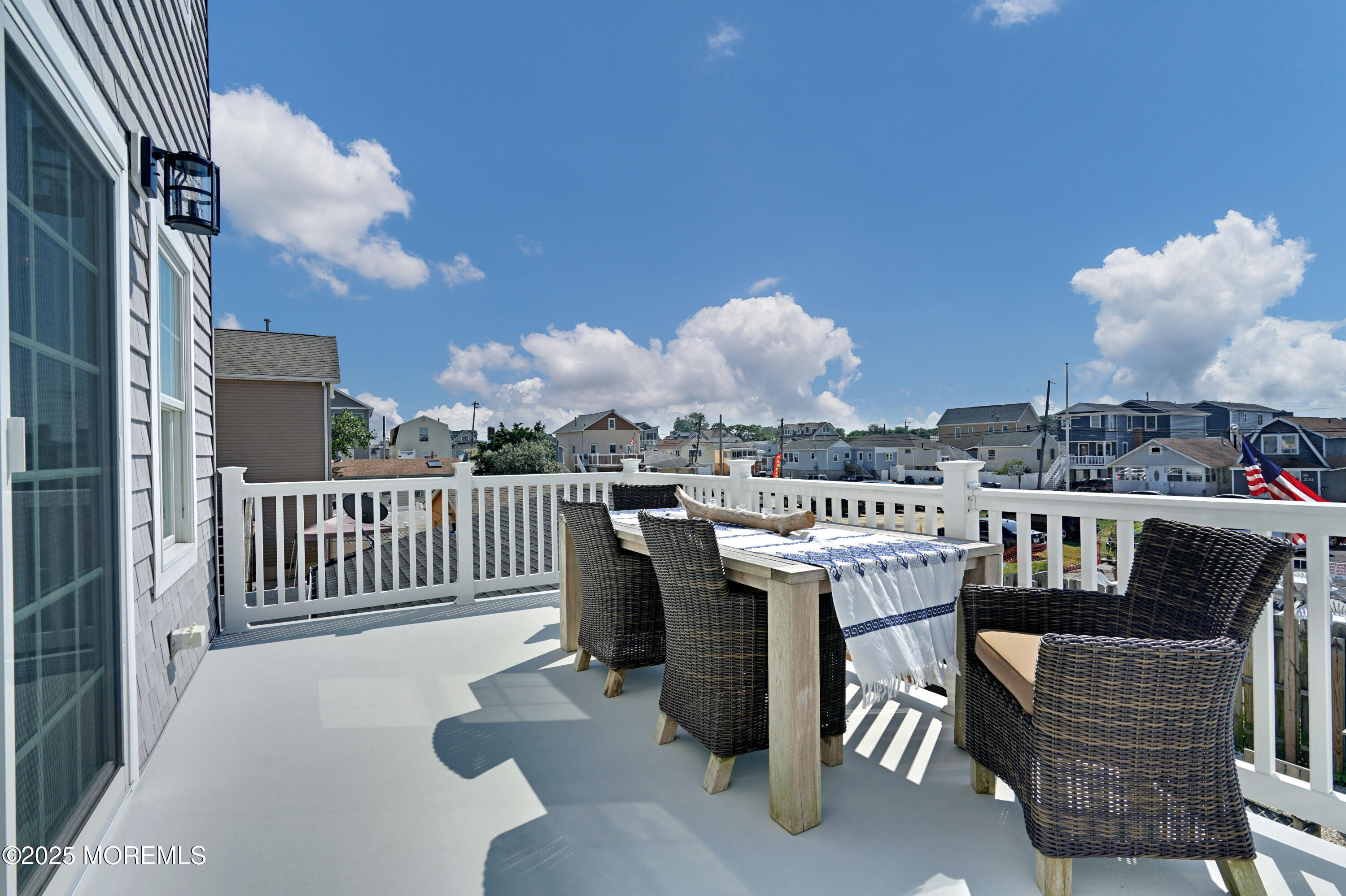 229 1st Avenue Manasquan, NJ 08736 - Photo 12 of 32 a outdoor dining space with furniture and a kitchen