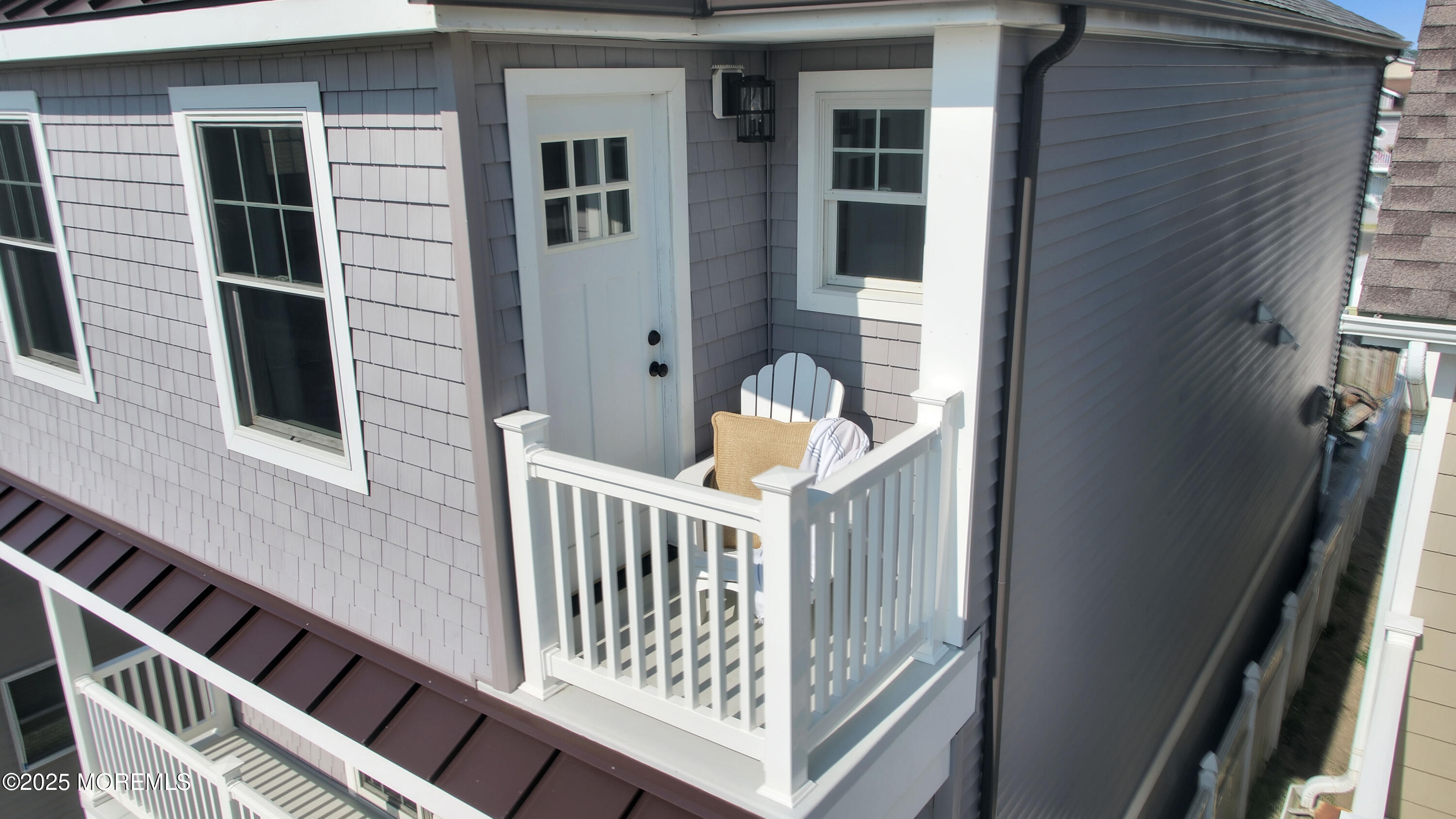 229 1st Avenue Manasquan, NJ 08736 - Photo 17 of 32 a view of a house with a deck