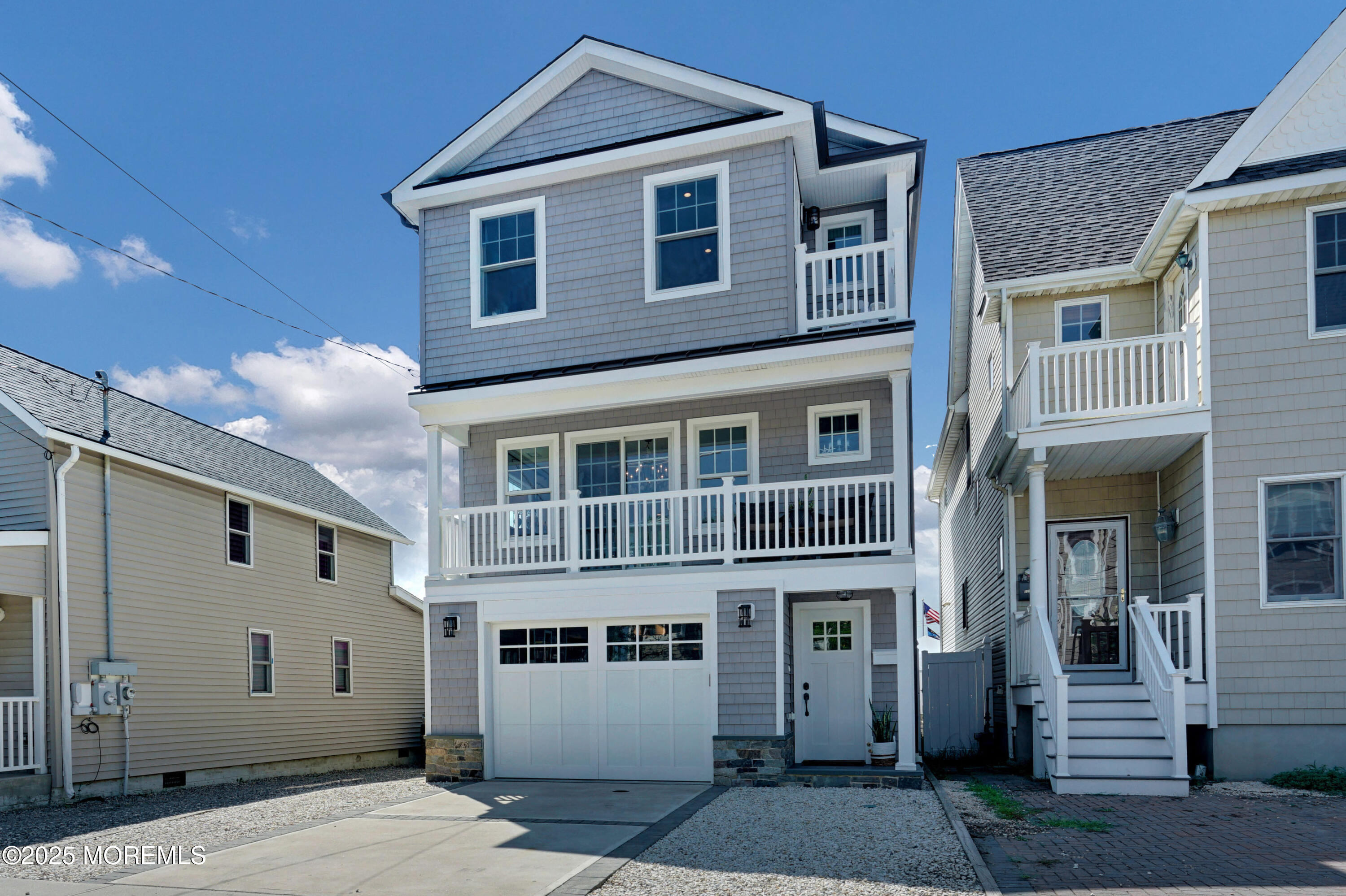 229 1st Avenue Manasquan, NJ 08736 - Photo 2 of 32 a front view of a house with a yard