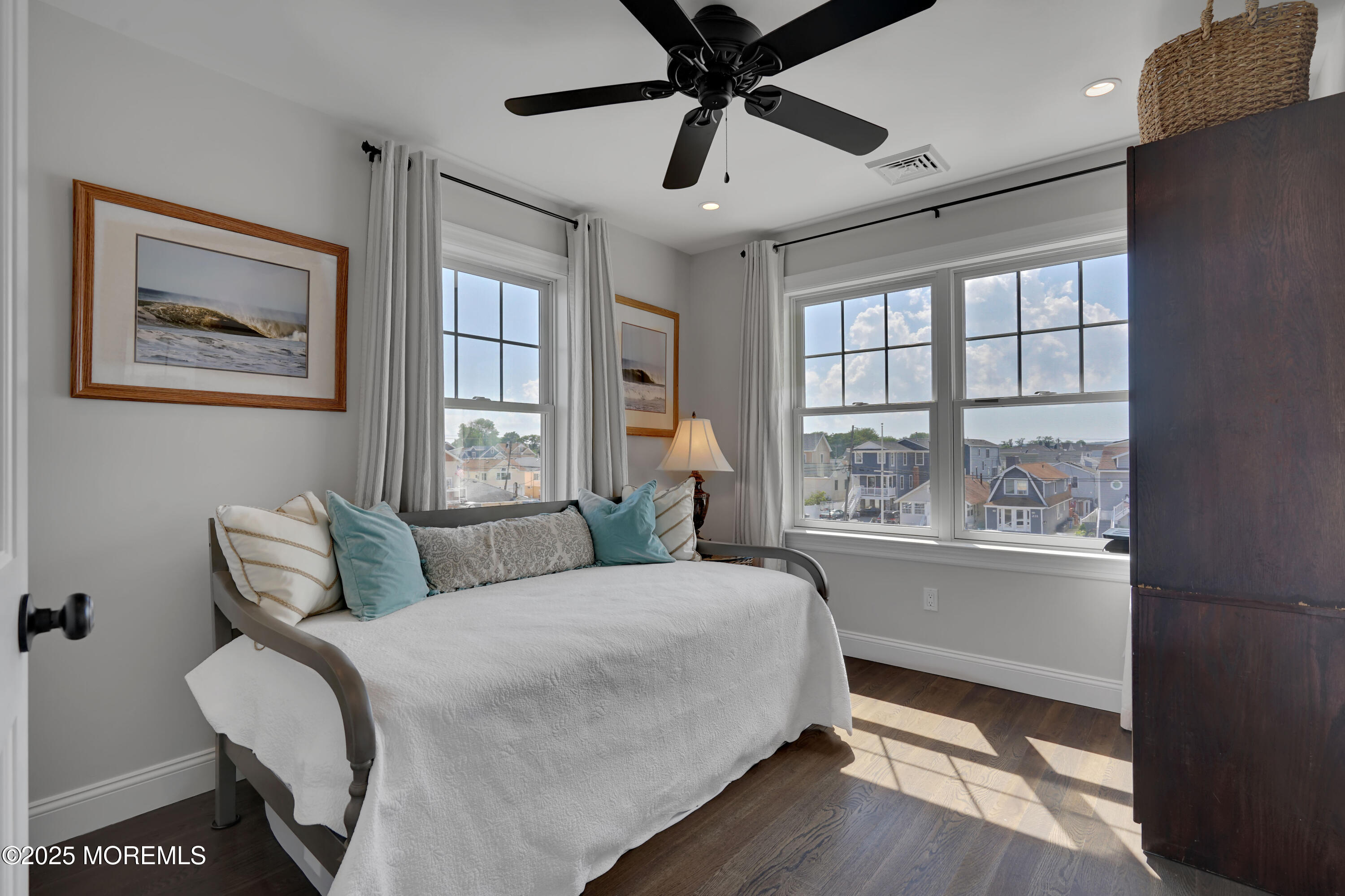229 1st Avenue Manasquan, NJ 08736 - Photo 25 of 32 a bedroom with a bed and wooden floor